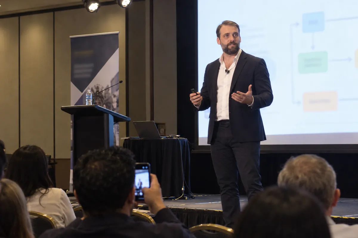 Damien speaking at a business conference